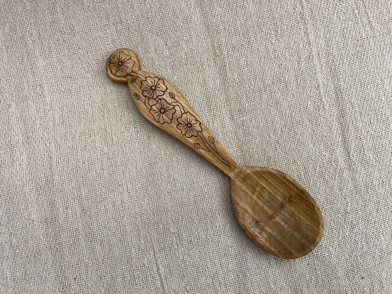 7” hand carved eating spoon. Cherry with kolrose pattern. Tung oil finish.